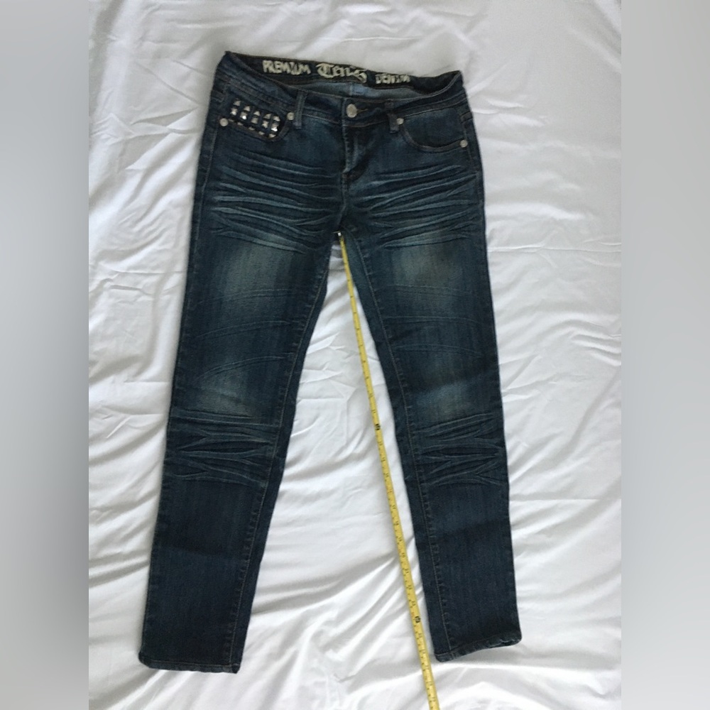 Y2k ten25 stretchy tapered jeans with metal accents.